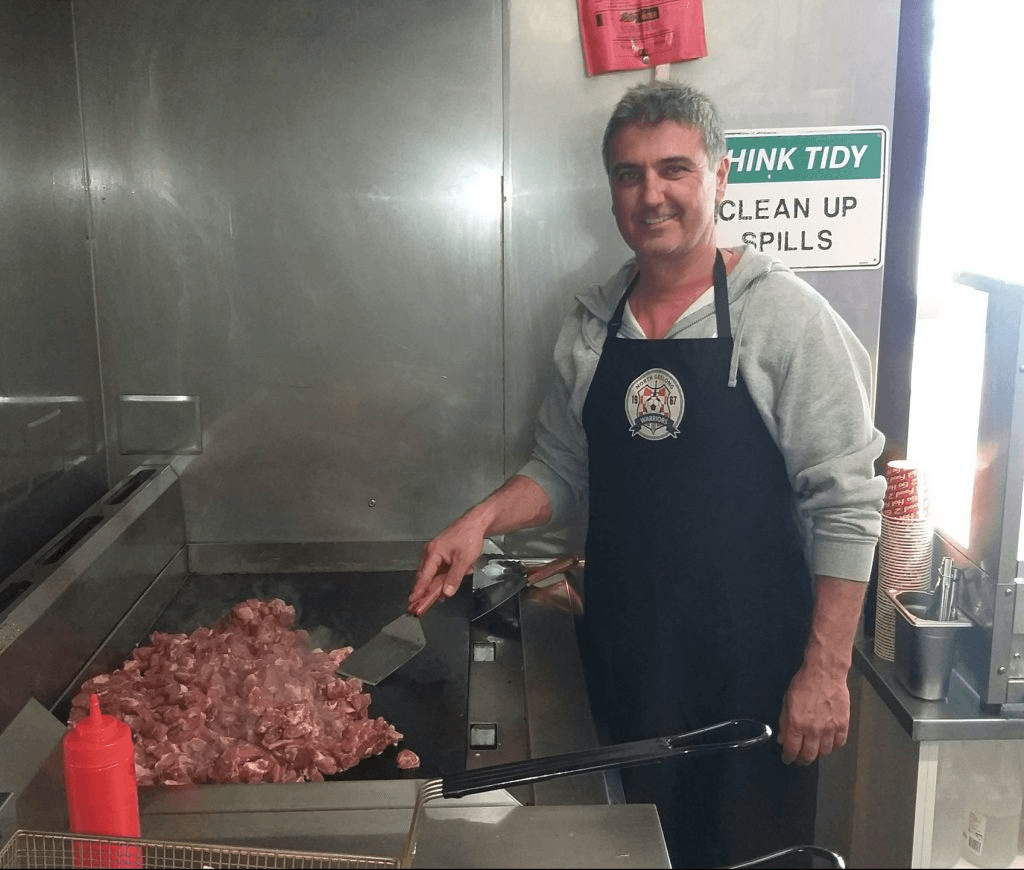 Club volunteers assisting at the North Geelong Warriors canteen on matchday.