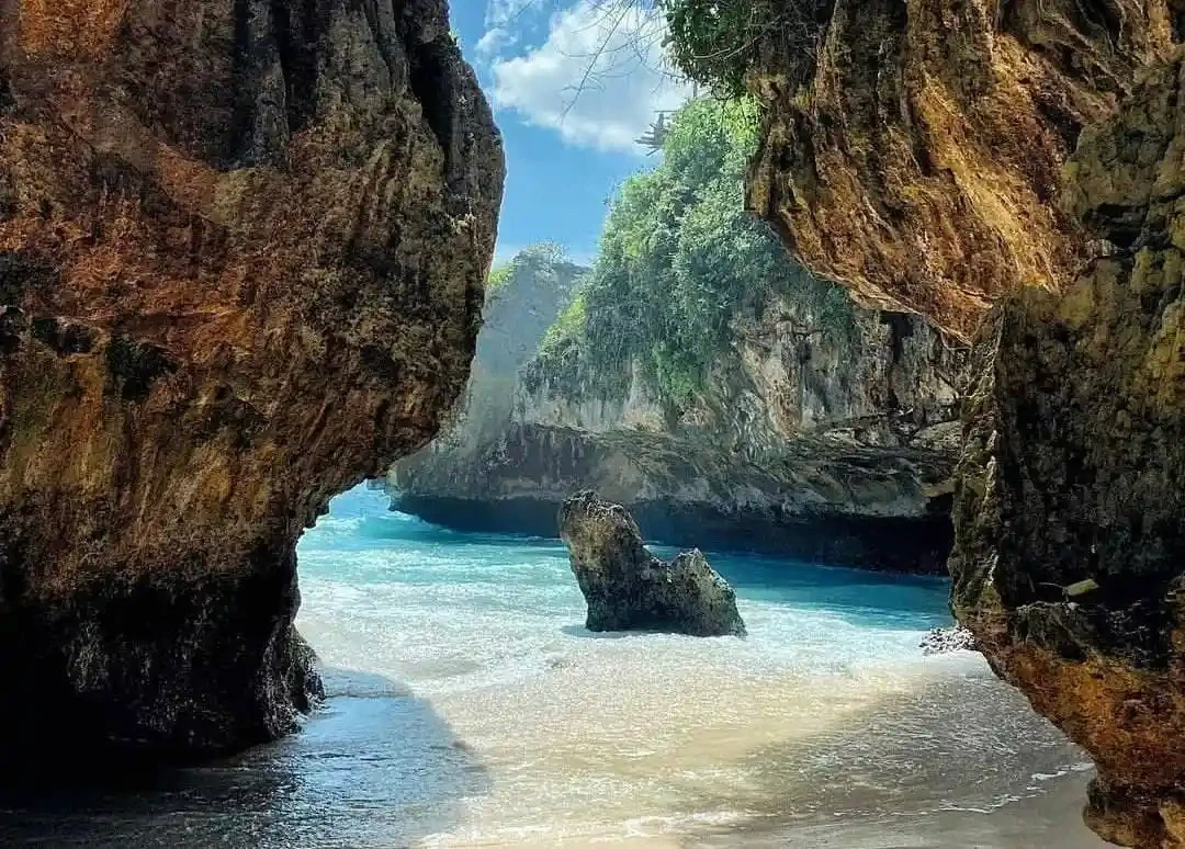 Hidden tropical beach rocky cove.