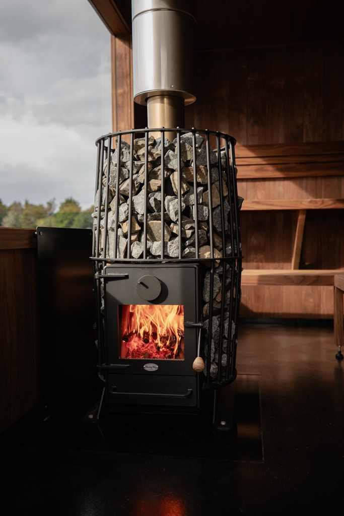 Therapist using herbal compress on back