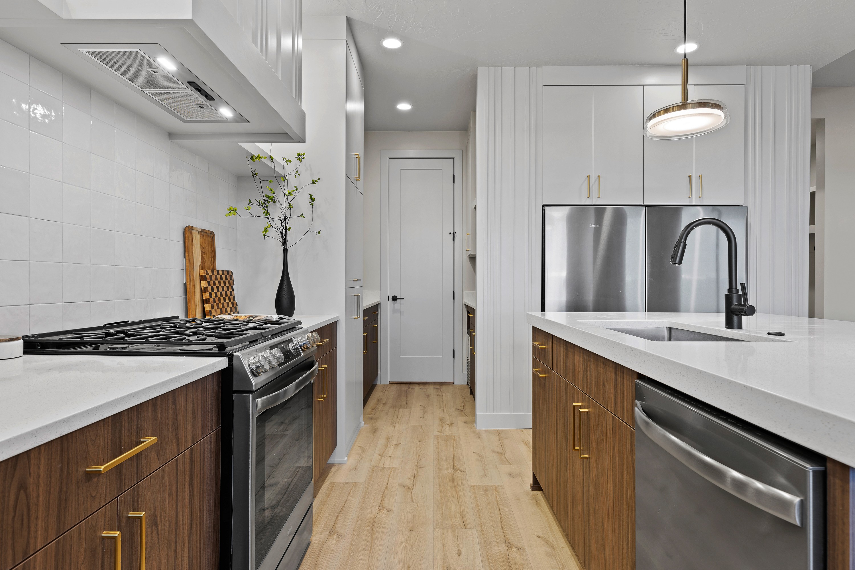 Kitchen detail in The Painted Horizon twin home in Hurricane, Utah featuring cabinetry, countertops, and a cohesive layout for everyday living.