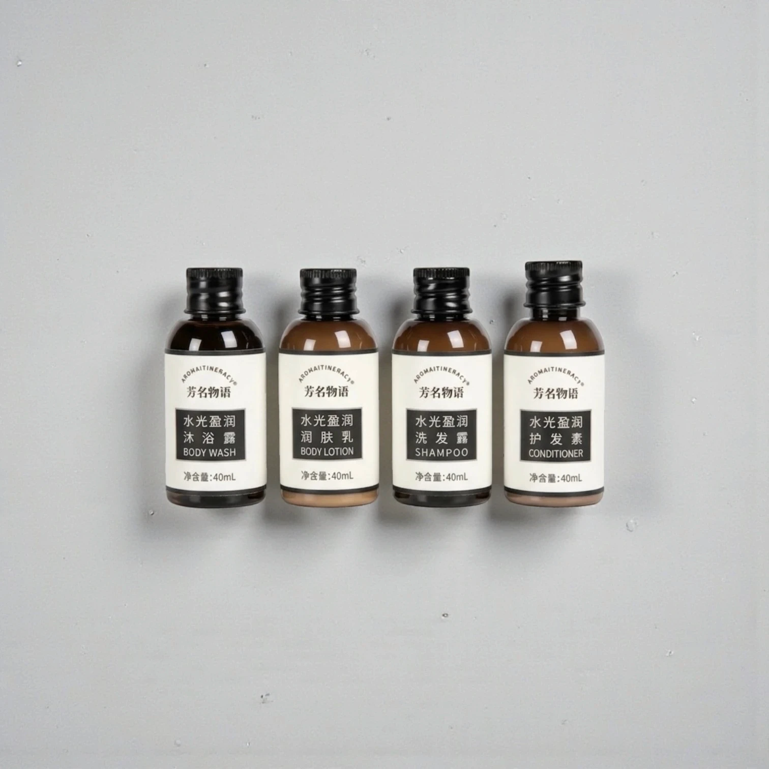 Bulk hotel amenities kit with sustainable packaging, featuring customizable bottles and logo branding for boutique hotels and hospitality chains.