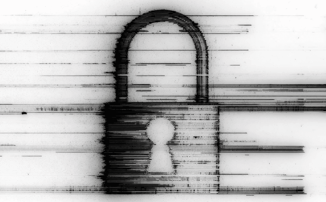 Two colleagues collaborating over paperwork at an office desk, with plants in the background.