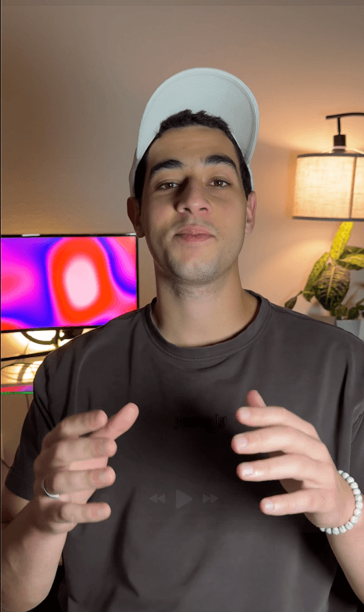 man standing beside wall