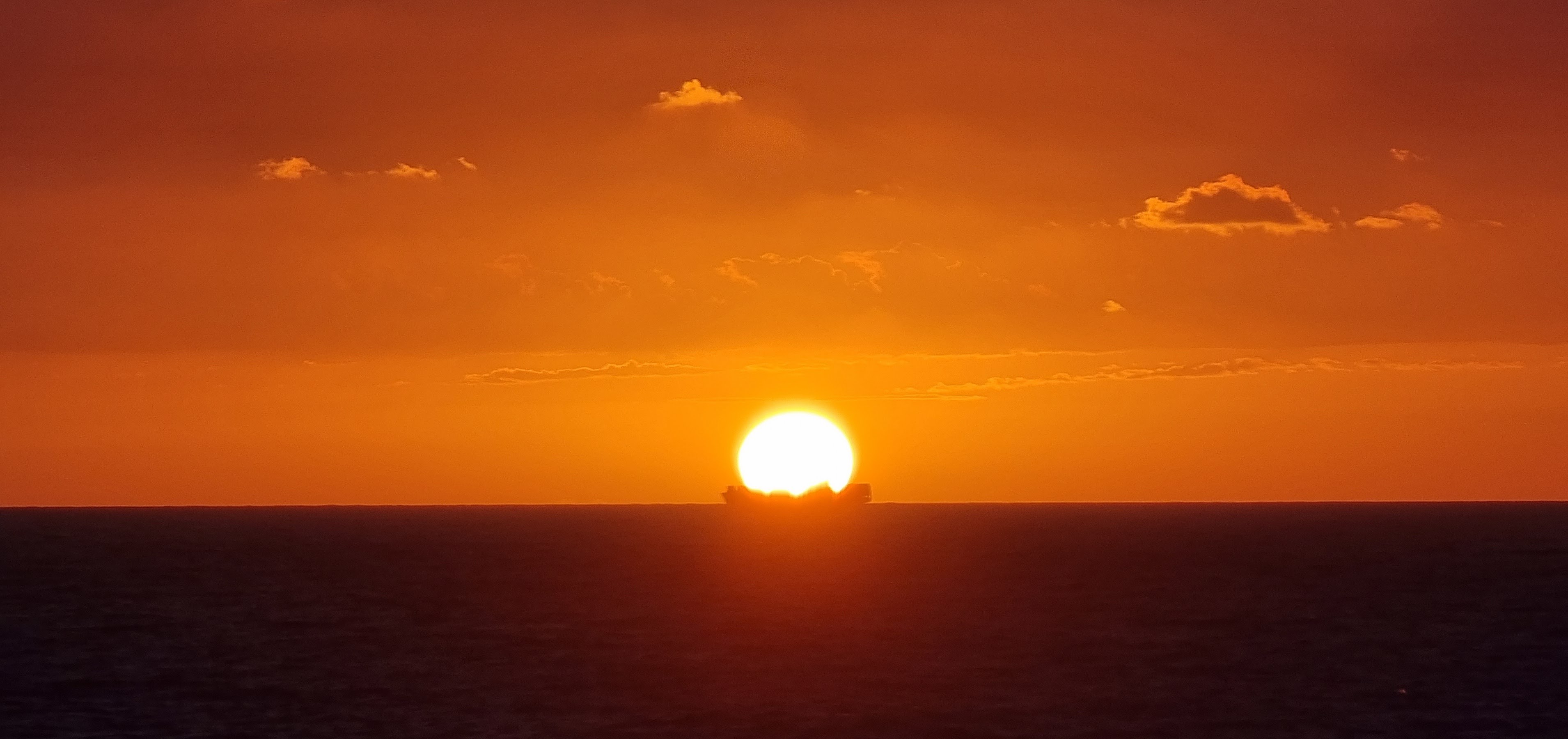 Sunrise with a boat