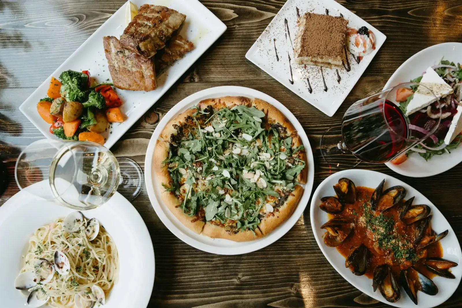 Authentic Italian food at Toscana Grill Calgary – pasta, pizza, seafood, wine, and desserts for dining and private parties