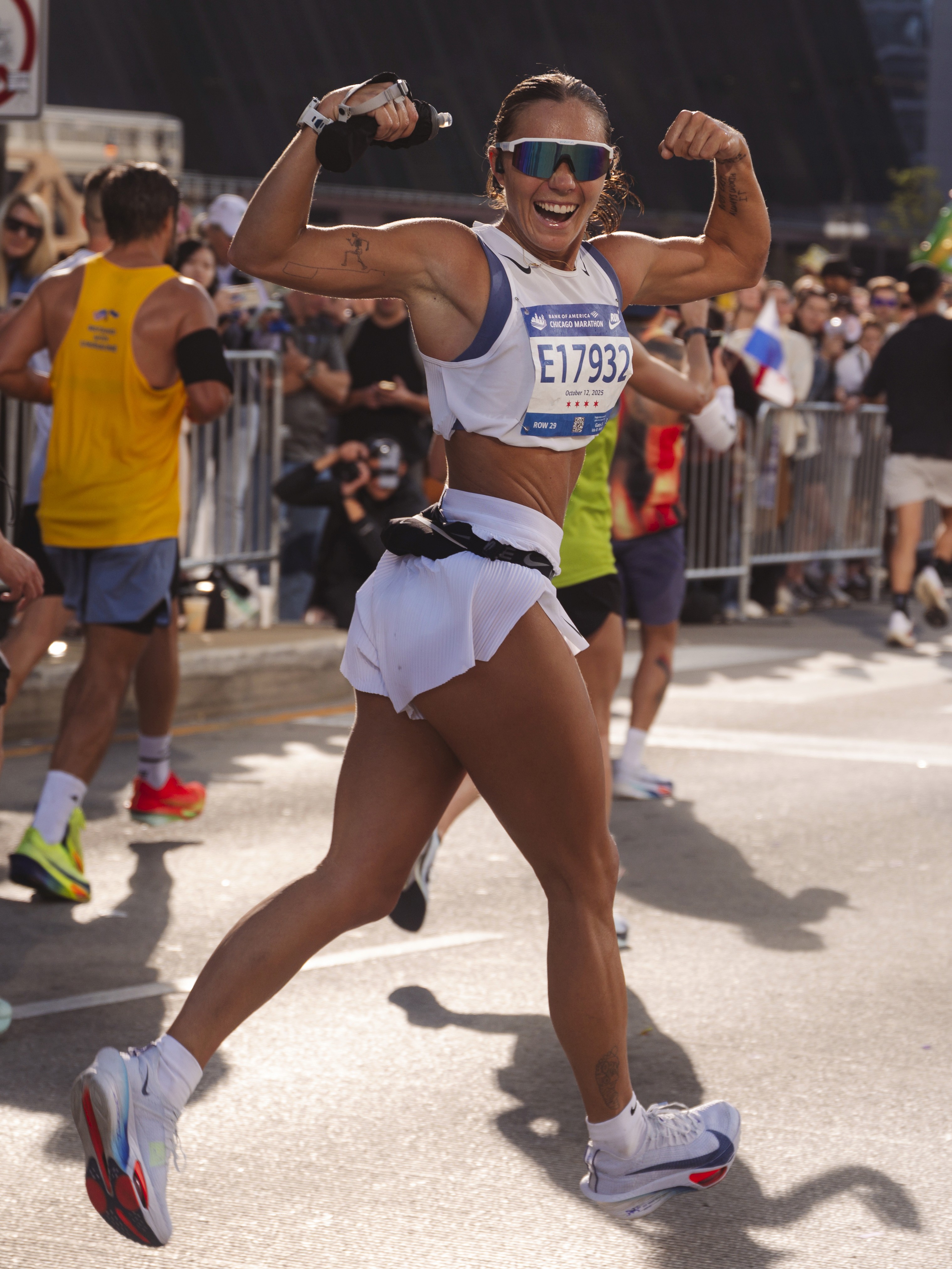 Rachel Stone, personal trainer working out sweaty with a barbell