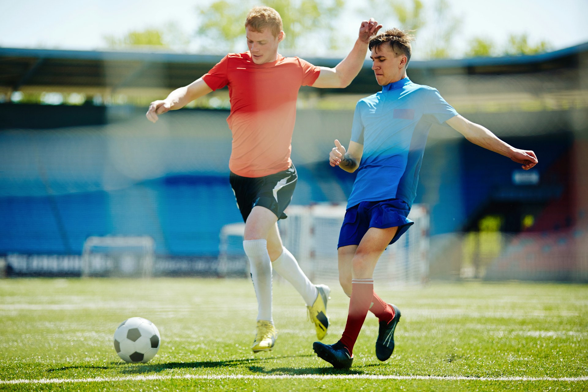 teens playing soccer