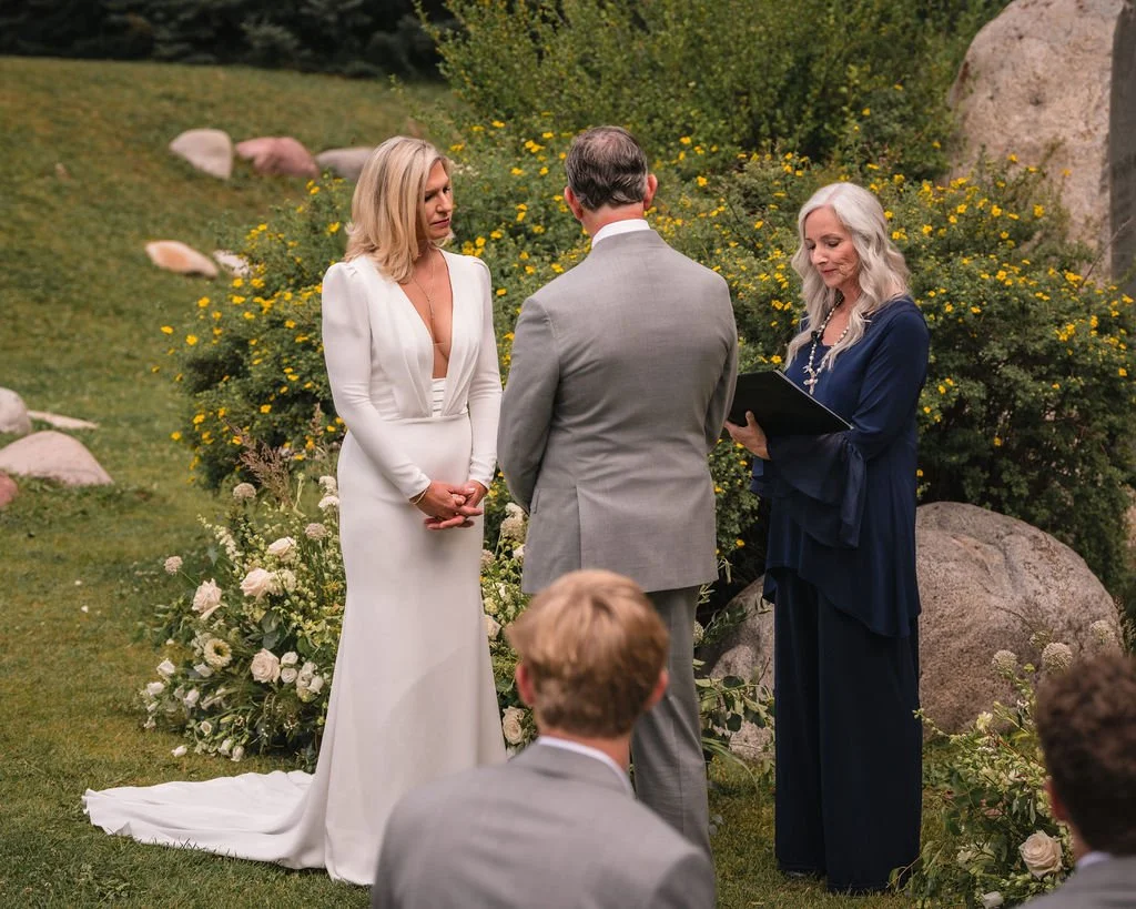 Guests watching heartfelt vows at Aspen mountain wedding