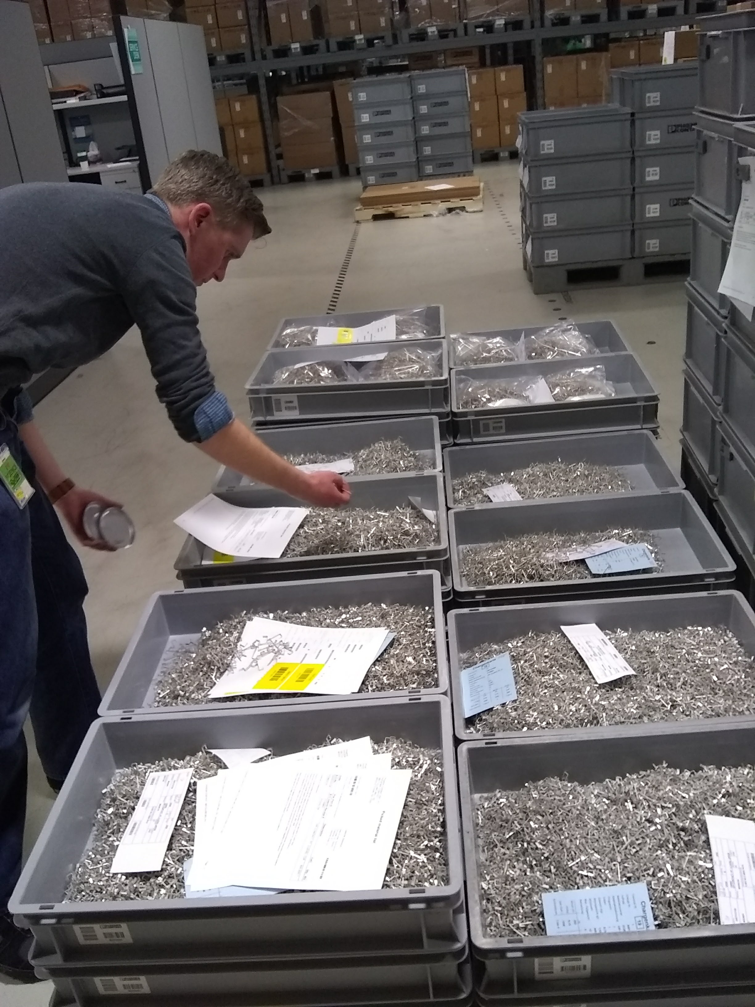 Photo of inspector going through bins