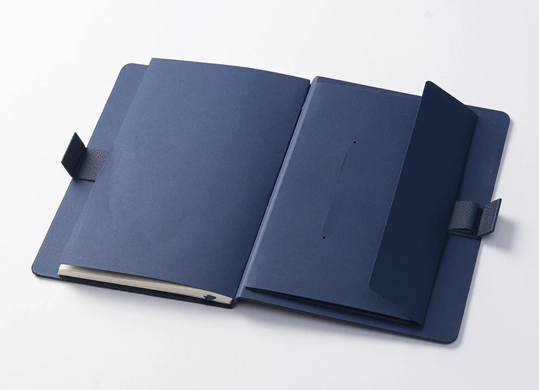 Open leather journal cover with inner pocket and notebook insert