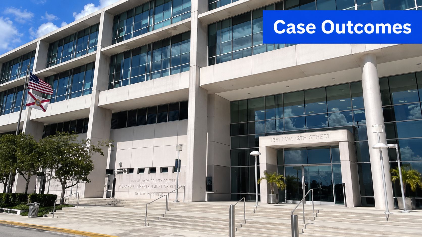 The Richard E. Gerstein Justice Building in Miami-Dade County, Florida with American and Florida state flags flying.