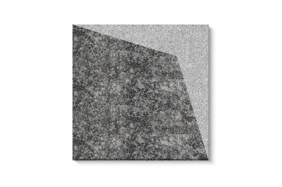 Qube stone tile with angular geometric pattern and textured grey surface for outdoor flooring