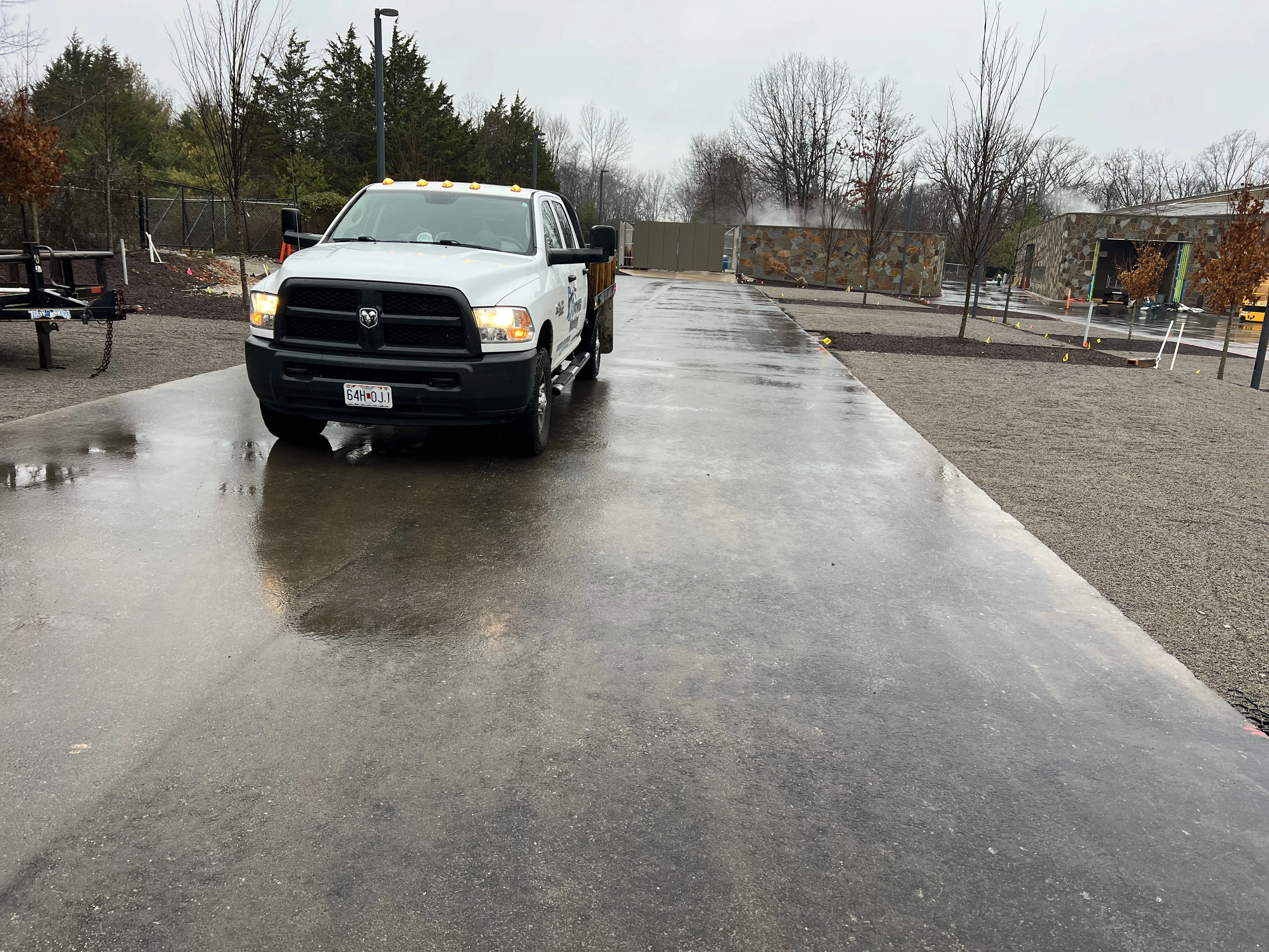 Oil stain removal from commercial parking lot surface