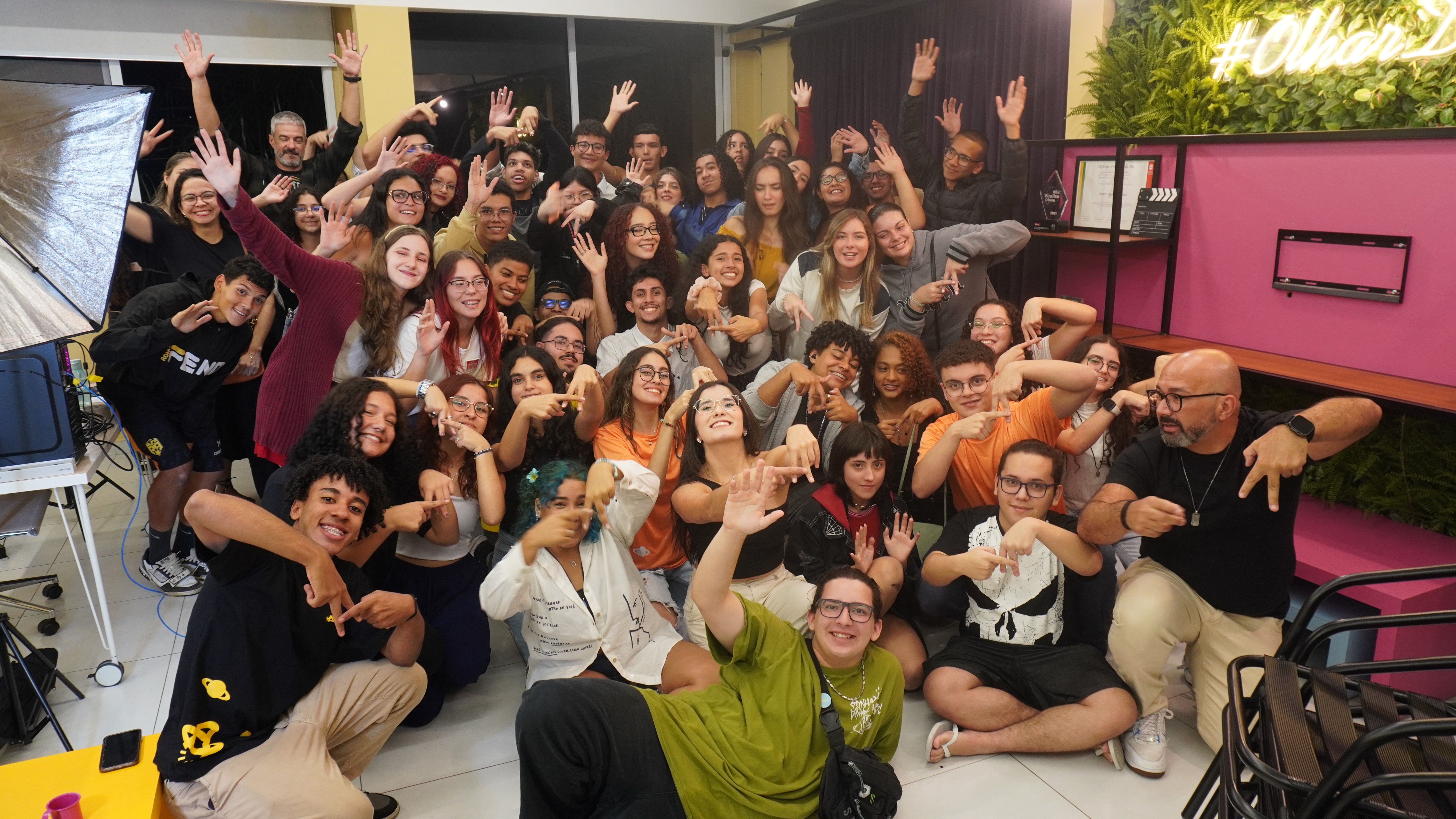 woman sitting around table holding tablet