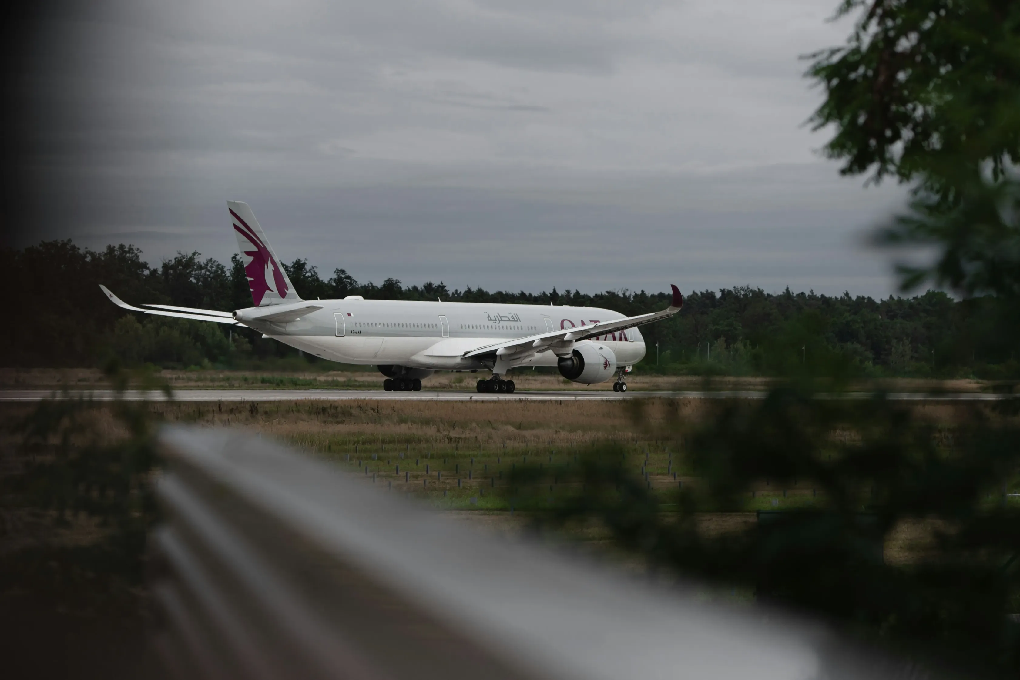 A large jetliner sitting on top of an airport runway