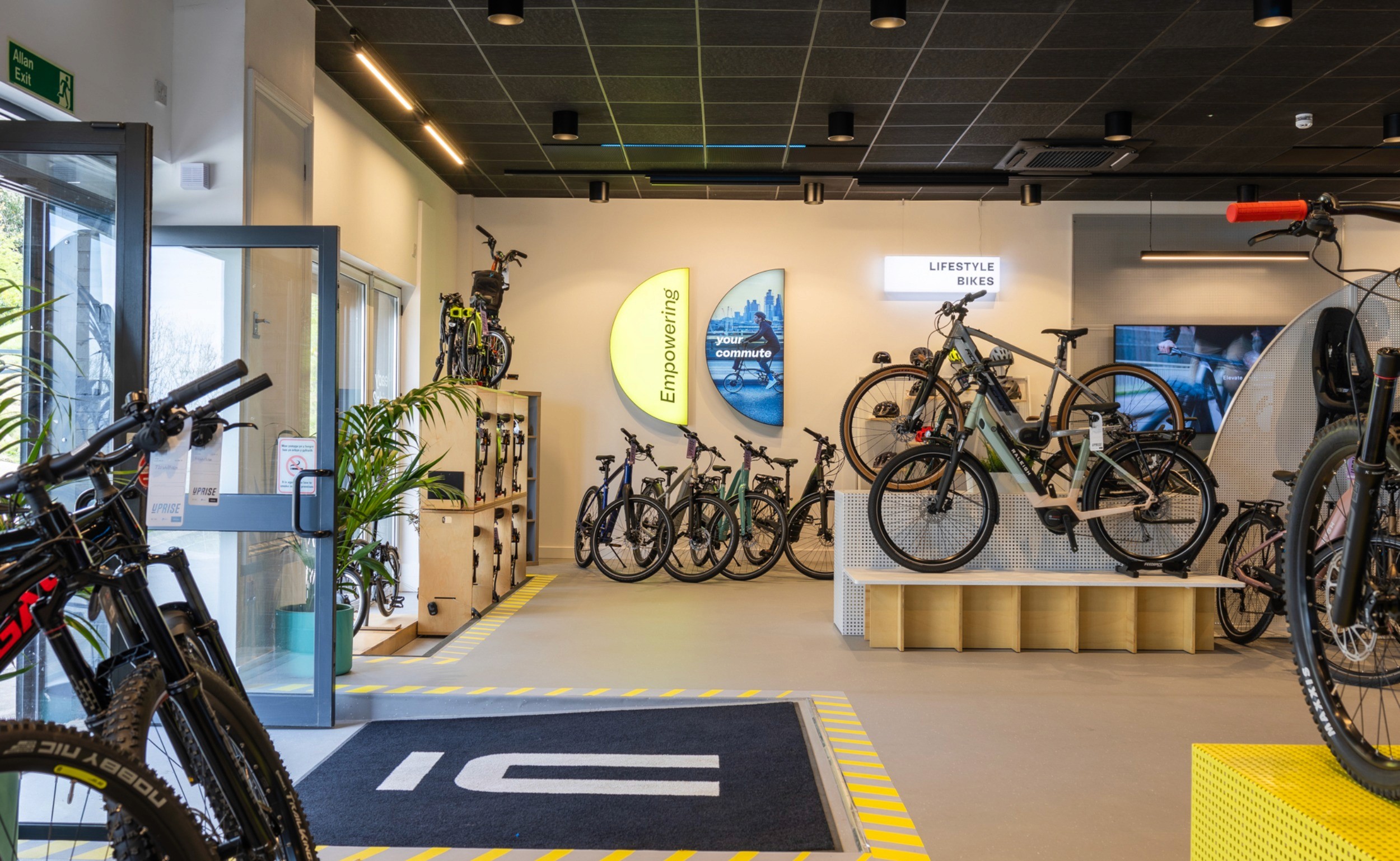 Modern bike retail store interior designed by a commercial design agency, showcasing strategic store layout, product zoning, and customer flow planning.