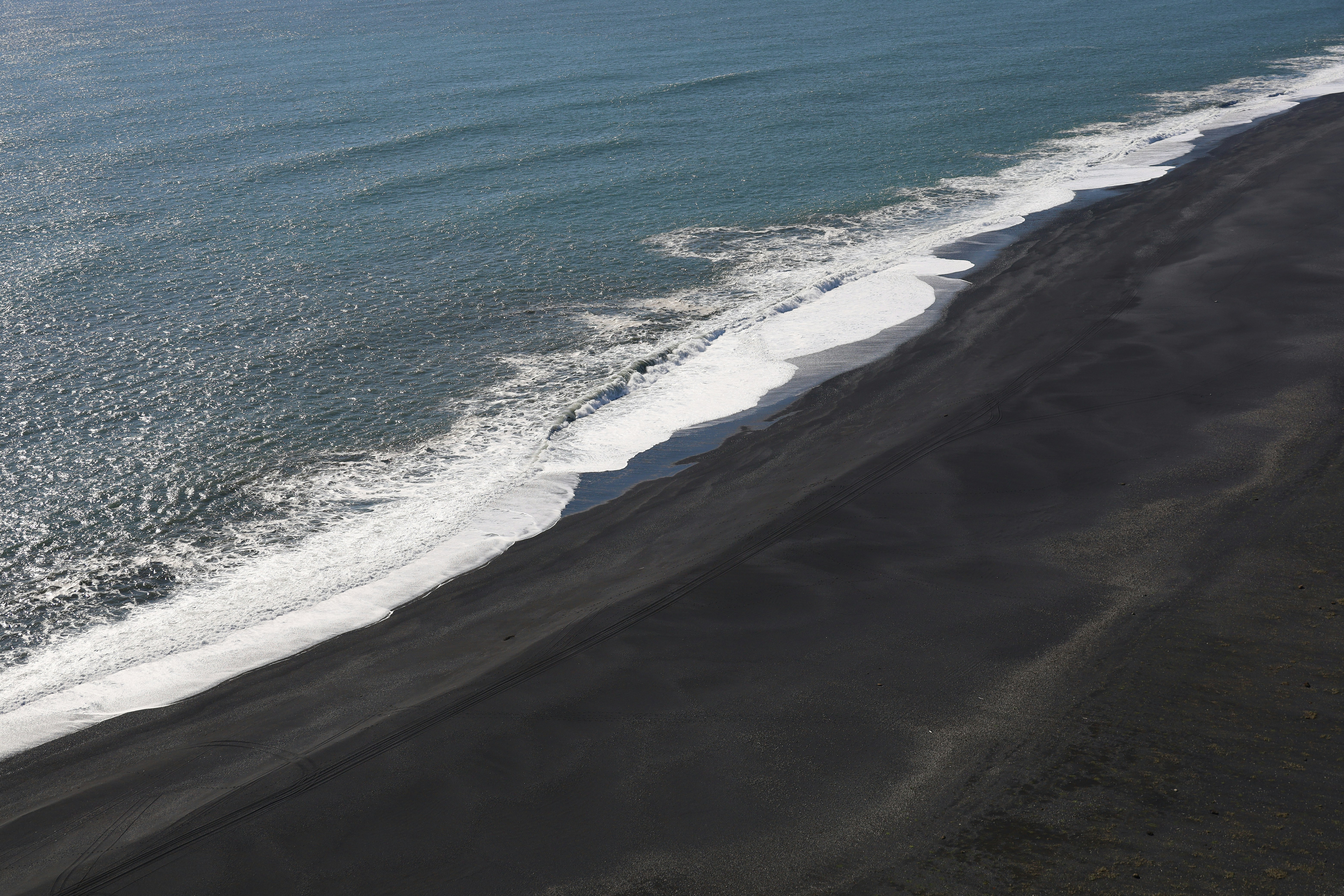 Quiet stretch of black sand beach along Iceland’s South Coast.