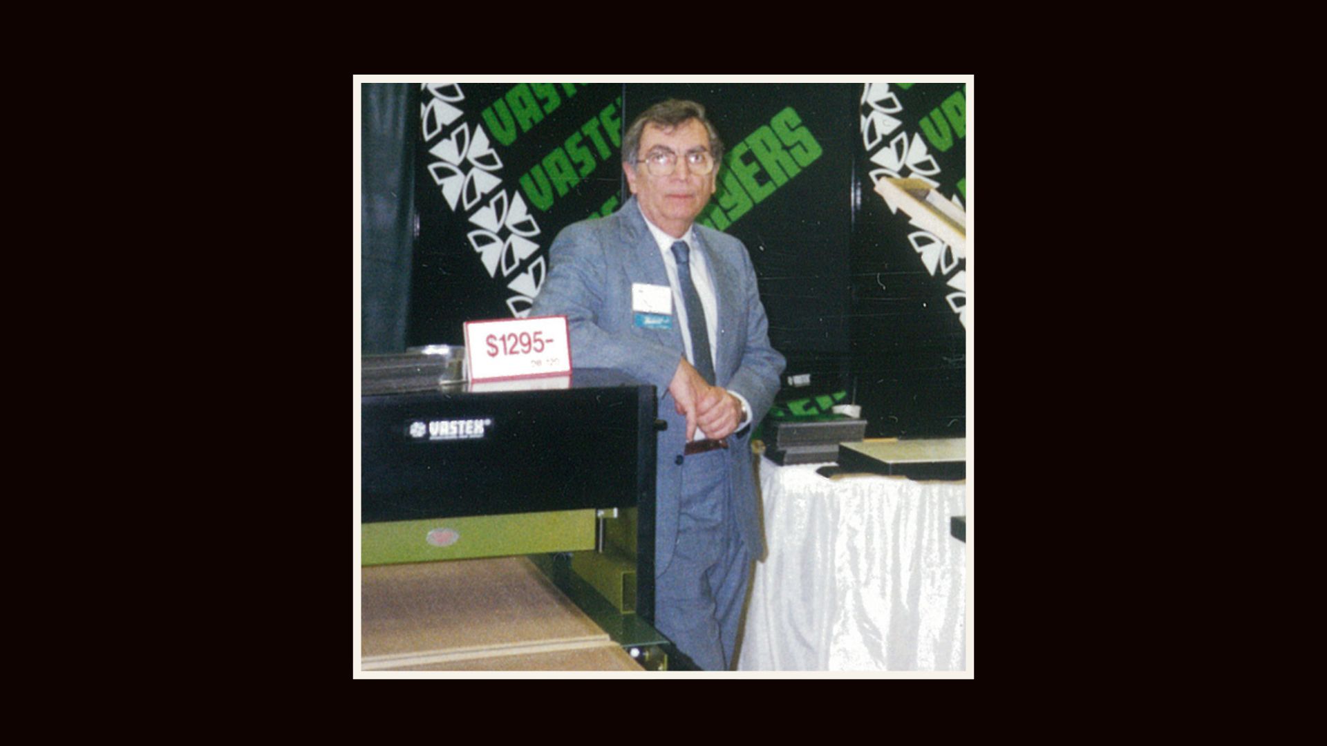 A picture of Michael Vasilantone next to his dual rotating printing press.