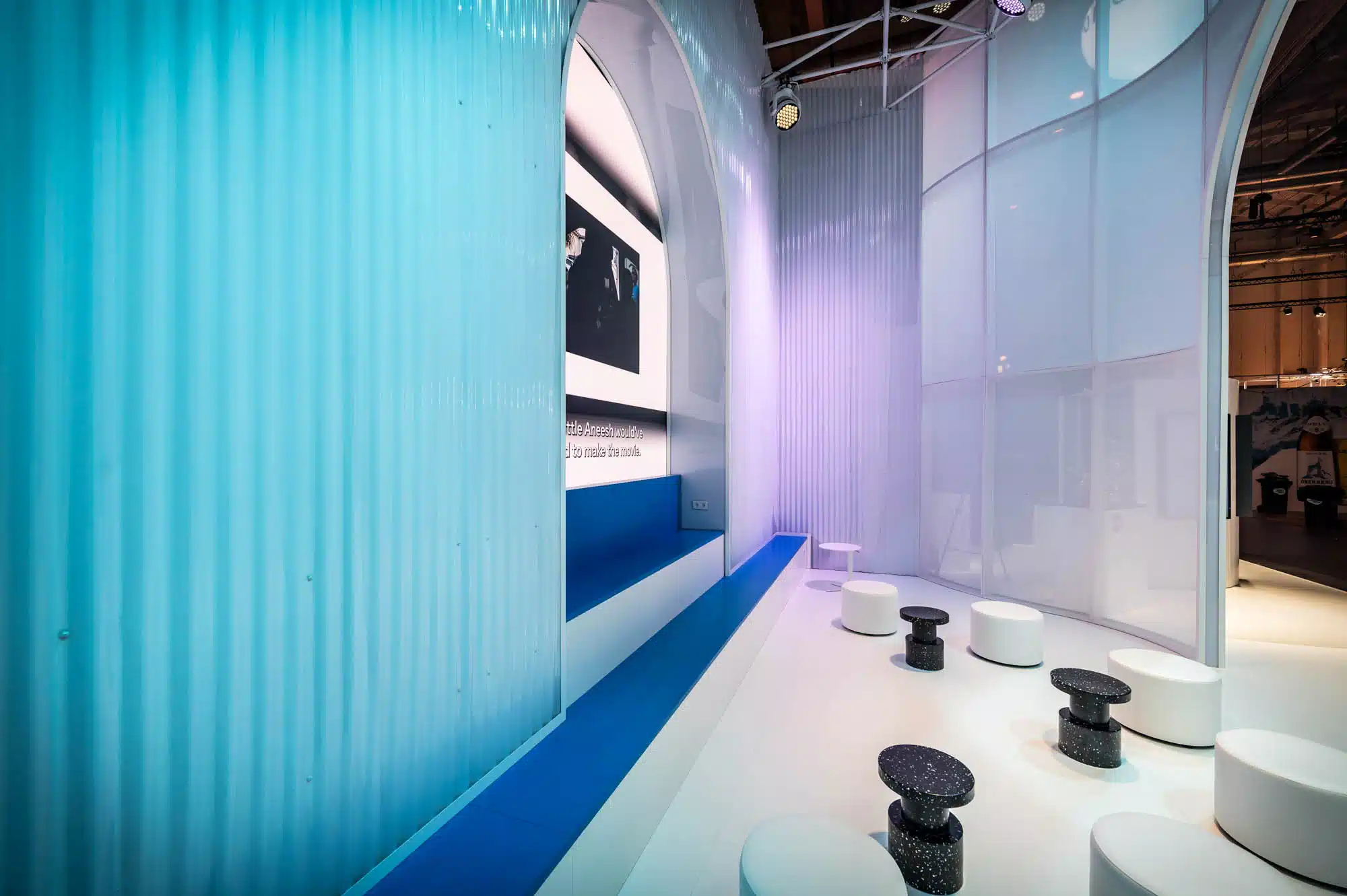 Meta – interactive AI demo area in the trade show booth with blue-violet architecture and screen installation