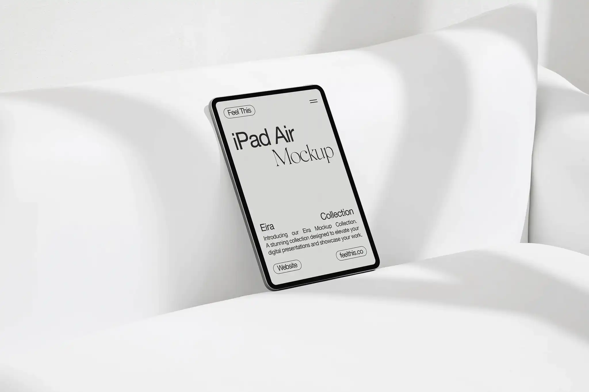 iPad Air mockup propped against a white couch in a minimalist setting. The sleek black screen contrasts sharply with the bright, soft fabric, emphasizing a clean and modern design aesthetic.