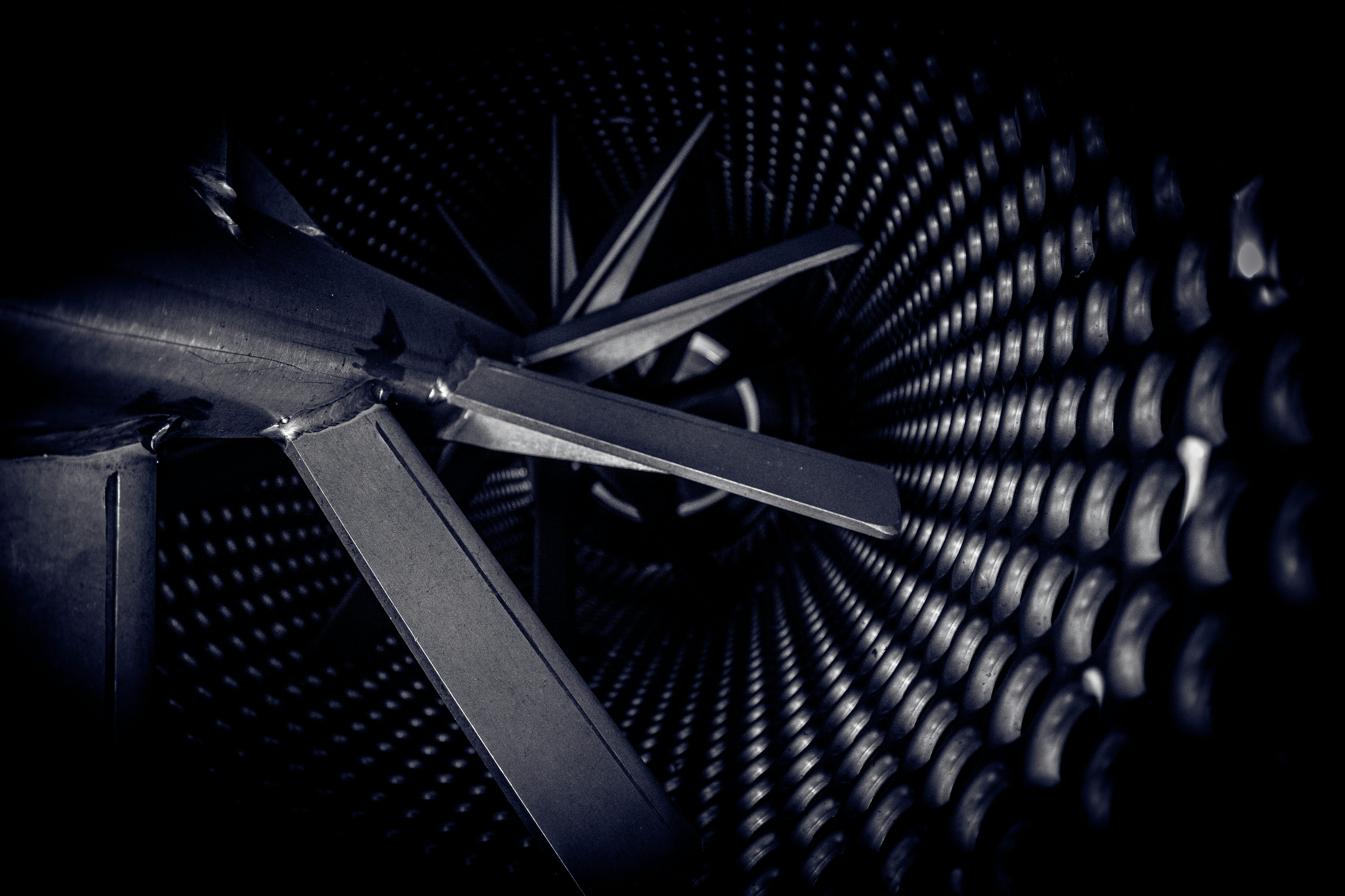 stainless steel plane on black metal frame