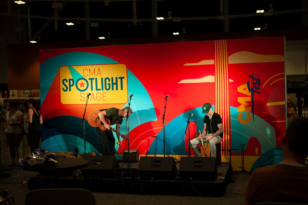Live acoustic performance on the CMA Fest Spotlight Stage, highlighting emerging artists and intimate fan experiences at Nashville’s premier country music festival.