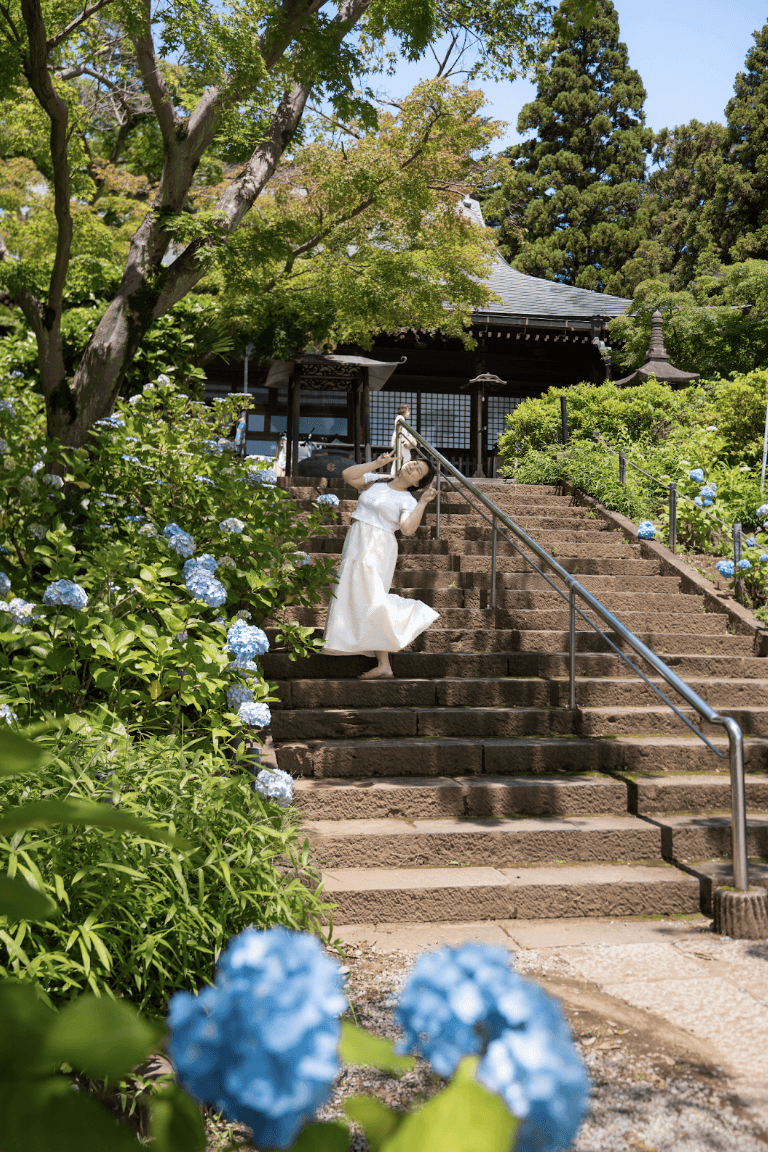 Person posing in front of hydreangas at Hondoji Temple in Chiba