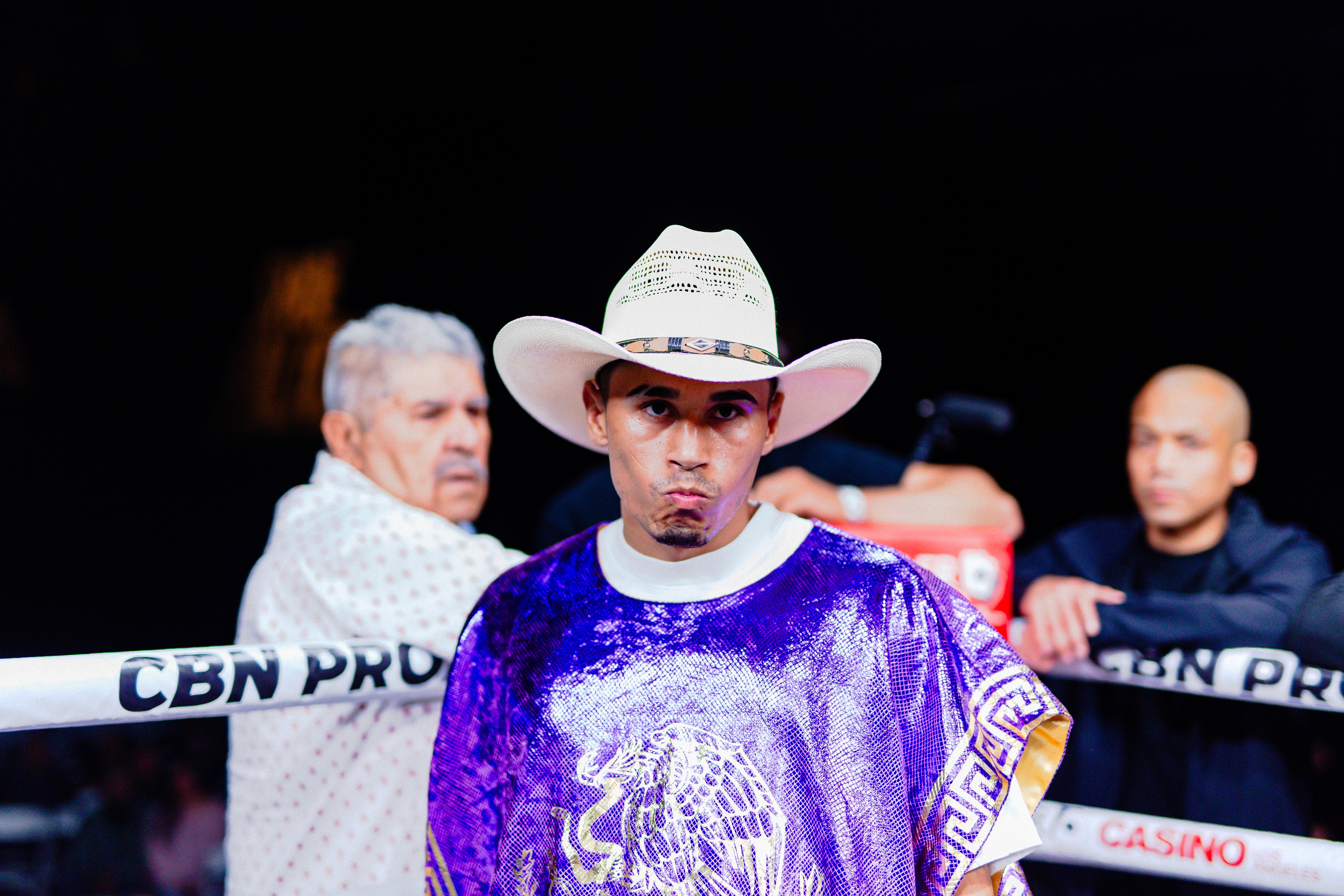 George "El Phantasma" Navarro in a cowboy hat and Kobe Bryant serape standing in his corner before a sanctioned boxing match at Thunder Studios in Long Beach CA