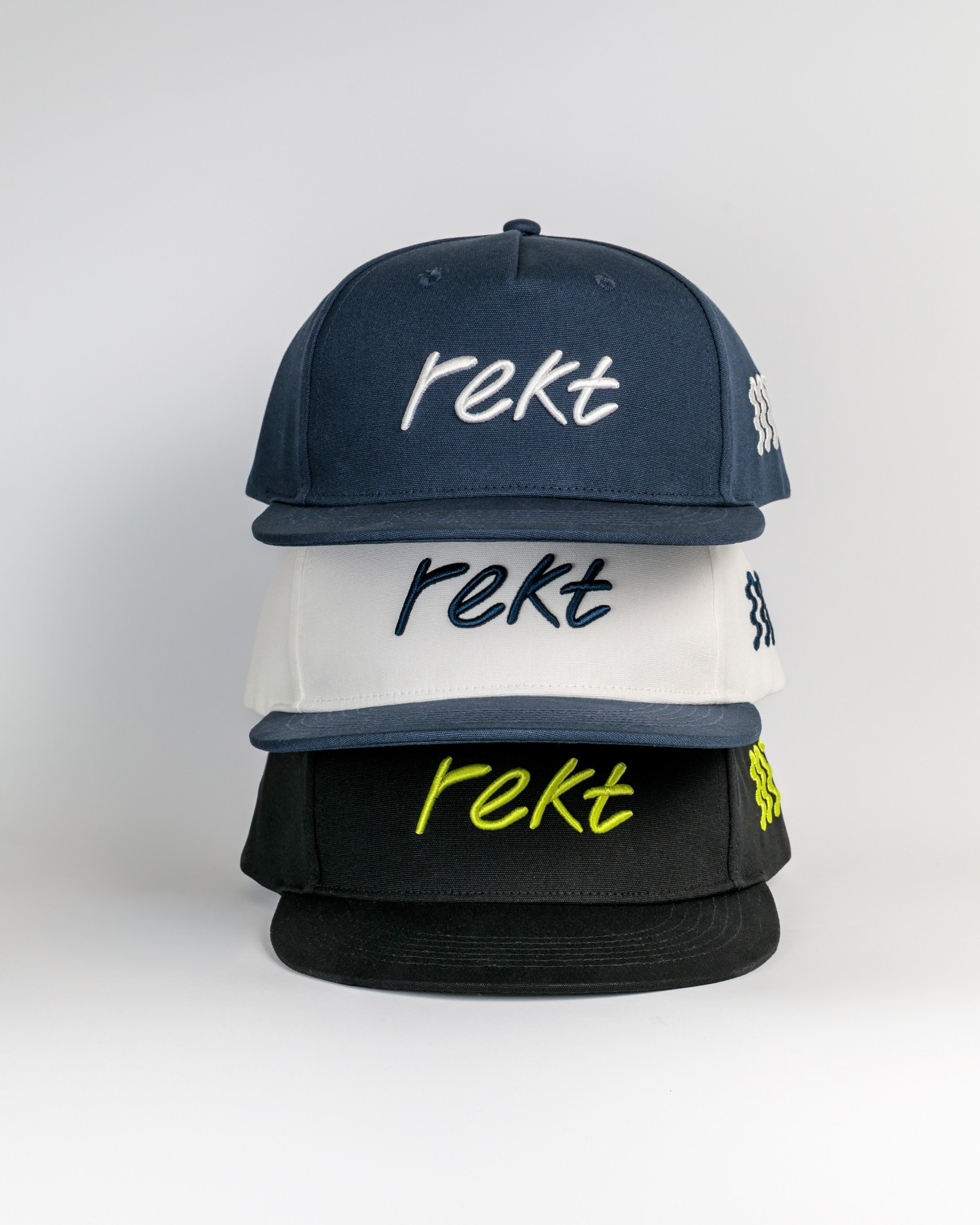 Rekt Drinks - stack of 3 caps in blue, black and white