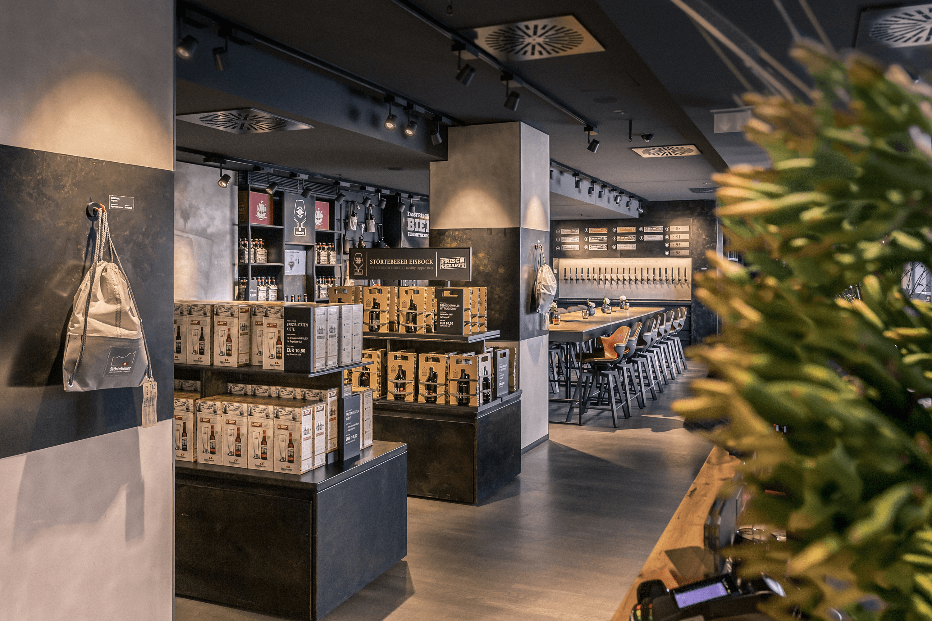 Beer boxes and bar seating in a modern establishment.