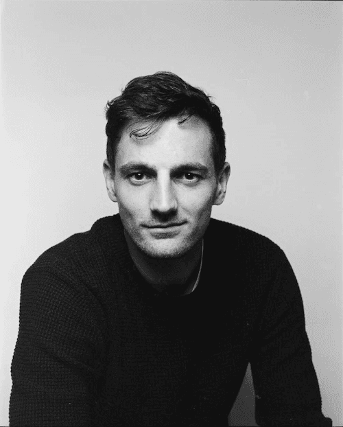A black and White portrait of Tom Kluyver