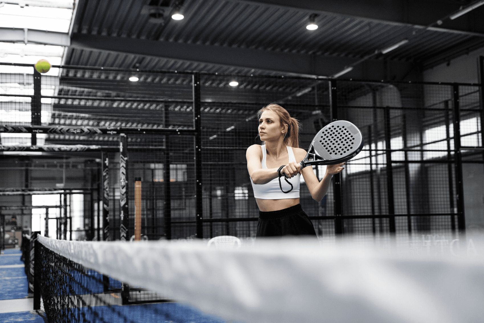 a tennis racket and ball on a court