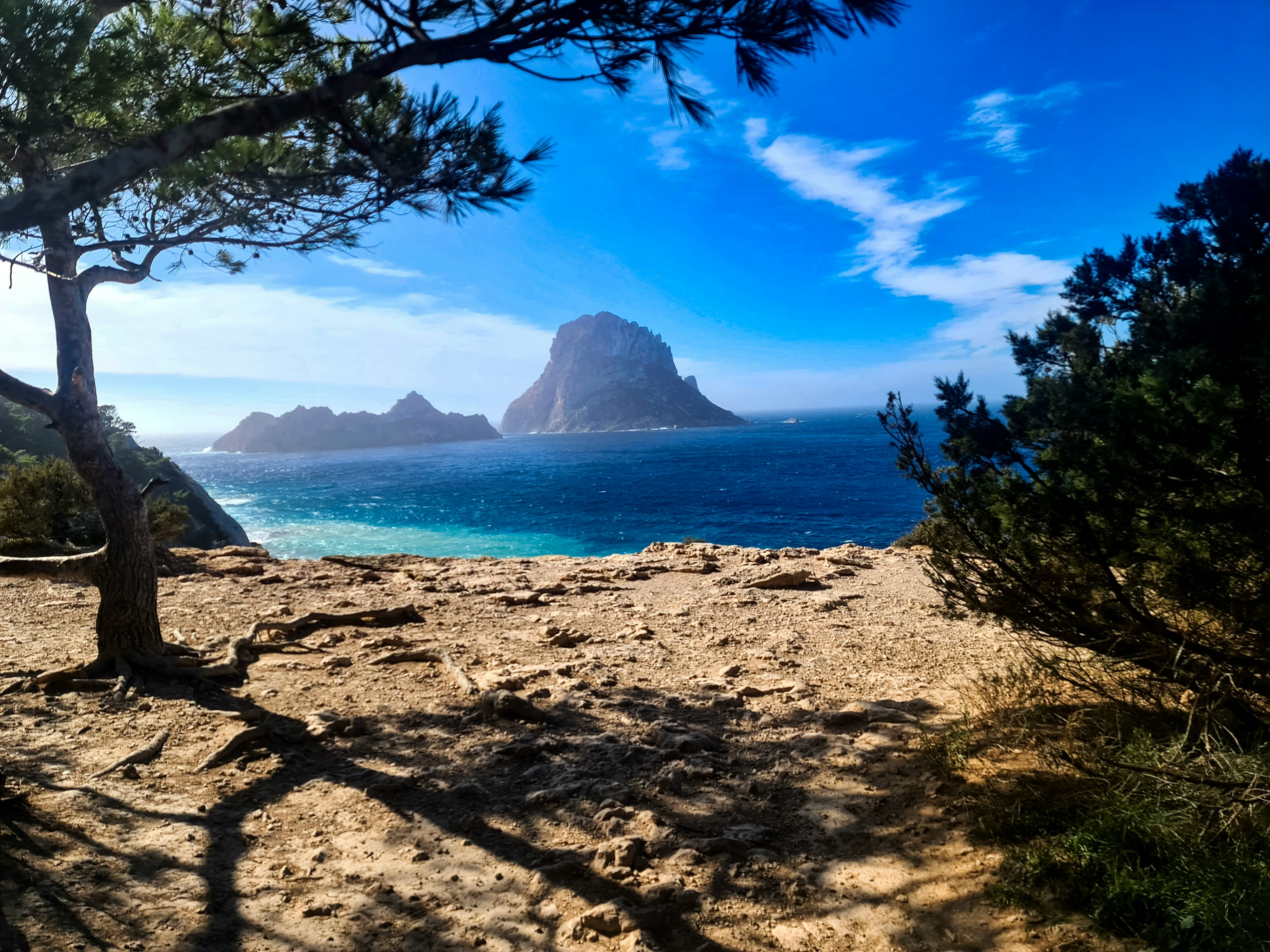 A scenic view of a beach with a mountain in the background
