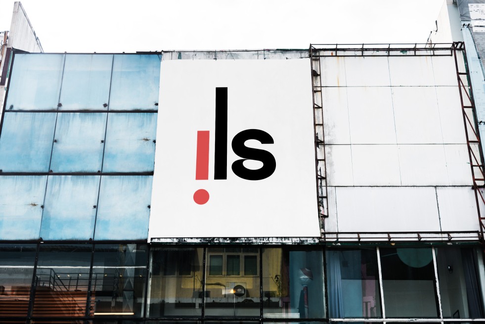 Large logo banner mounted on building.
