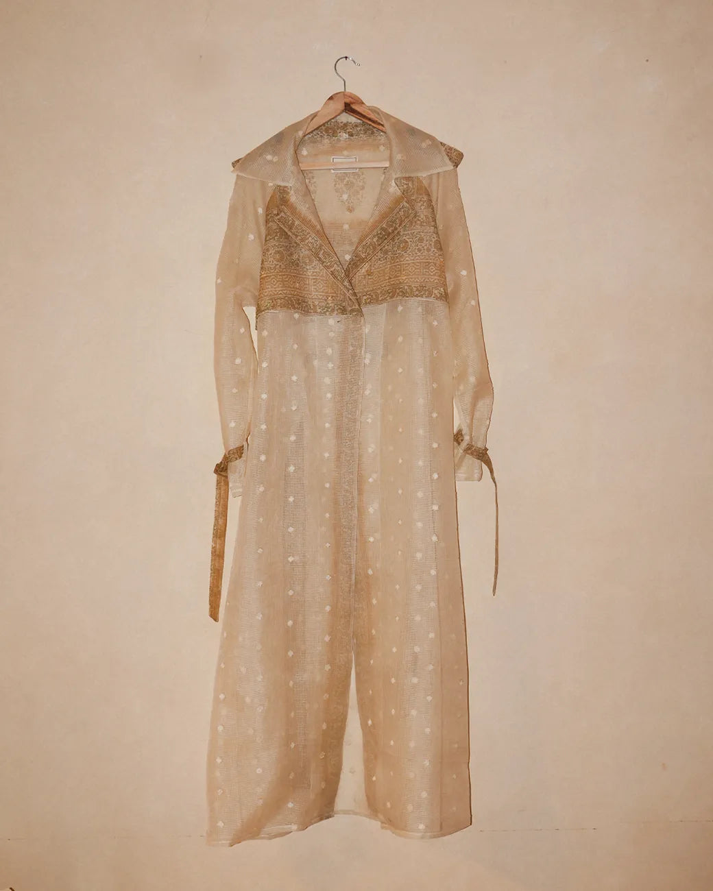 Vedyawhite checkered silk trench coat handcrafted from  silk with relaxed boxy fit, buckle details on arms and waist