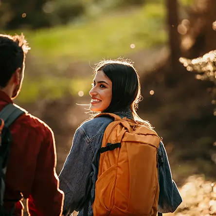 Woman looking at her partner with a sunny backdrop on a beautiful Summer day.