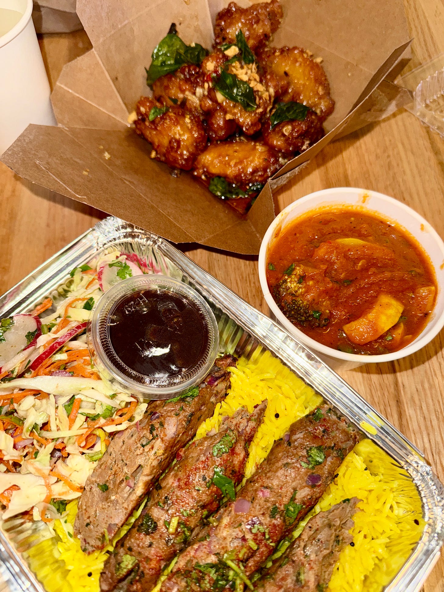 Bail chicken wings from White Elephant, Lamb Kehek with yellow rice & cabbage slaw with a side of vegetarian red curry from Adya