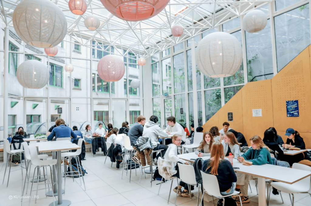 a group of children sitting on steps in front of a building