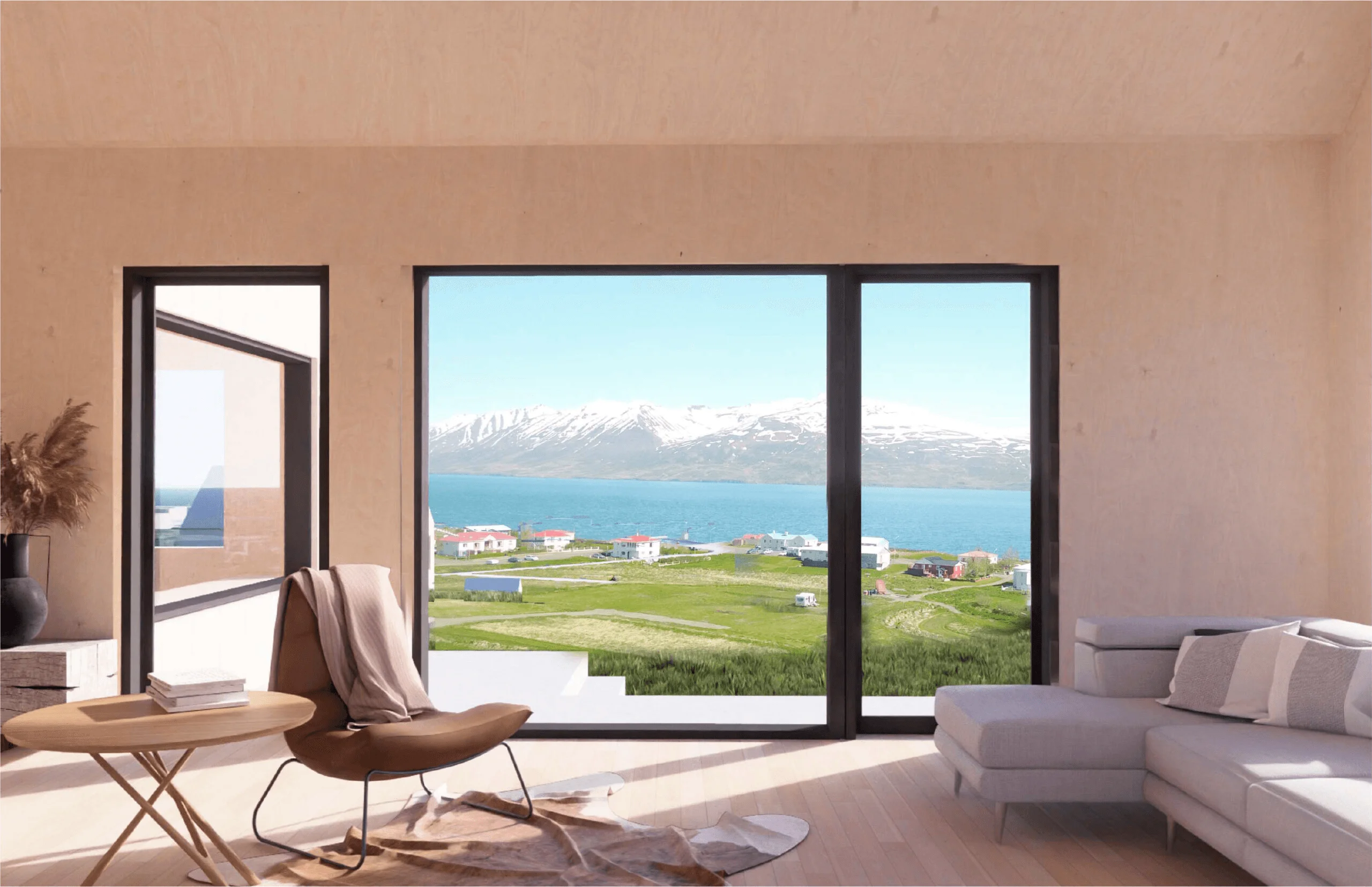 Hotel room interior featuring a lounge chair by a large window with ocean and mountain views.