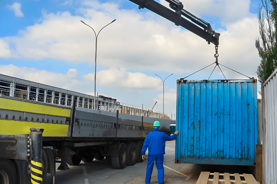 Truck with mounted crane performing a heavy lift rigging operation.
