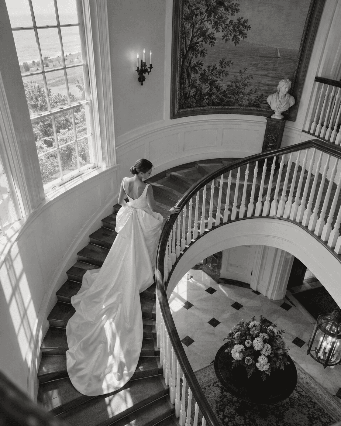 Bride descending a curved staircase