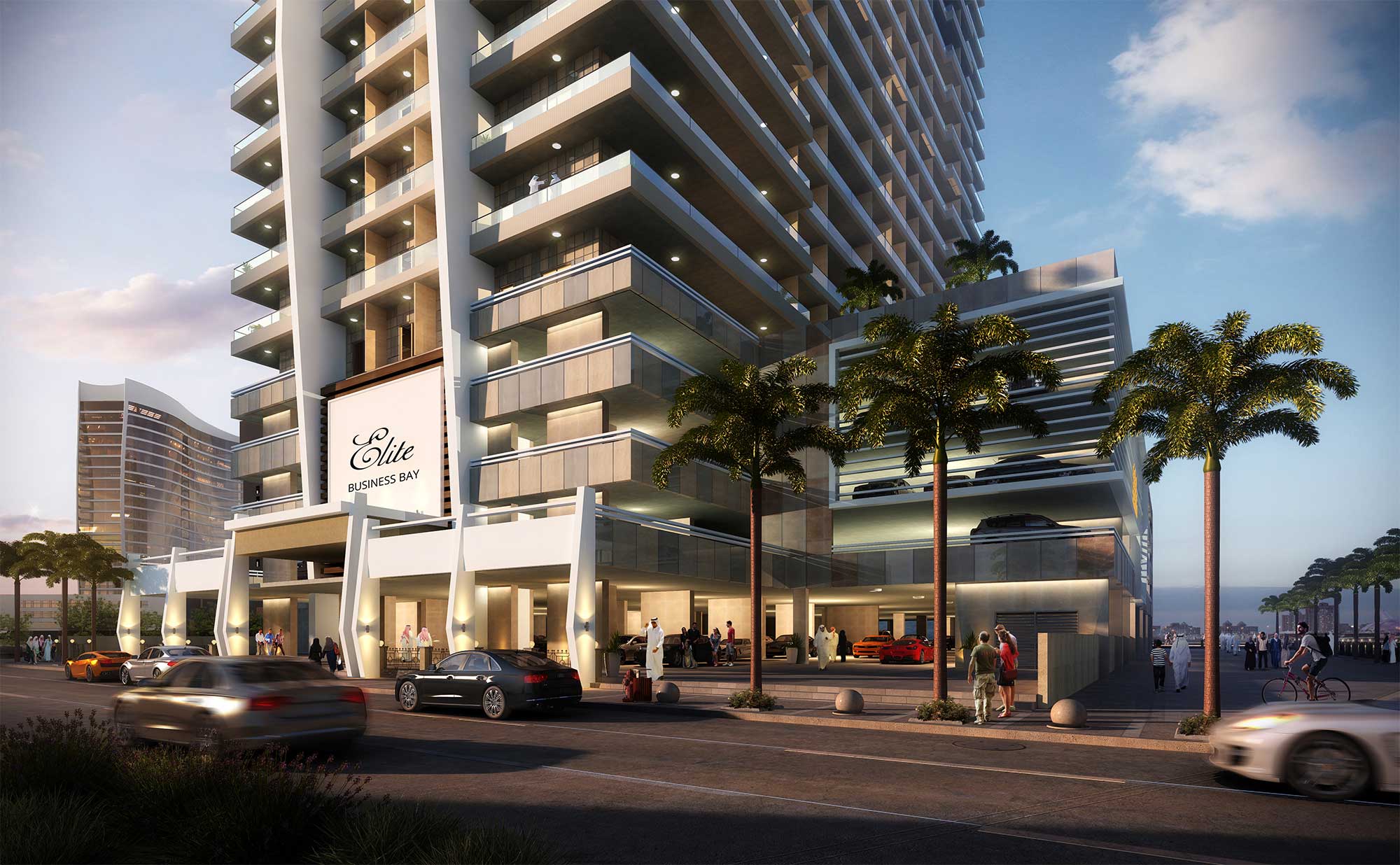 Modern entrance and podium of Elite Business Bay Residence at sunset with luxury cars and palm trees.