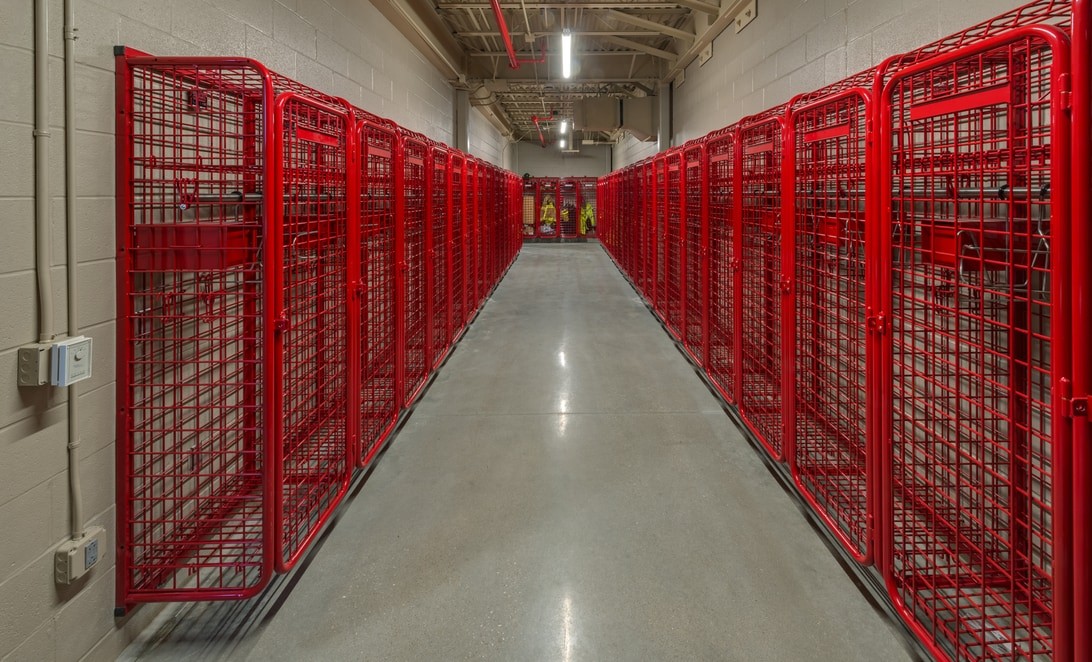 Turnout gear lockers lining a station corridor at HCESD 9 Fire Station 5, by Martinez Architects.