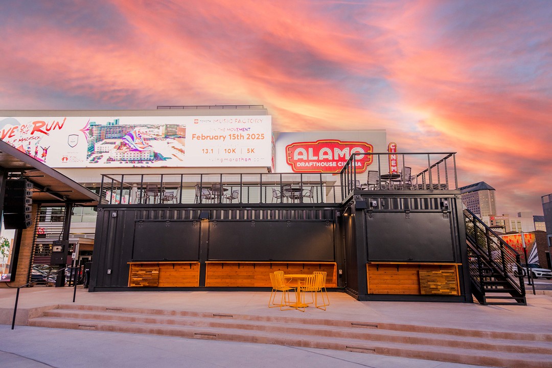 Sunset behind Alamo Drafthouse and container bar in Irving, Texas.