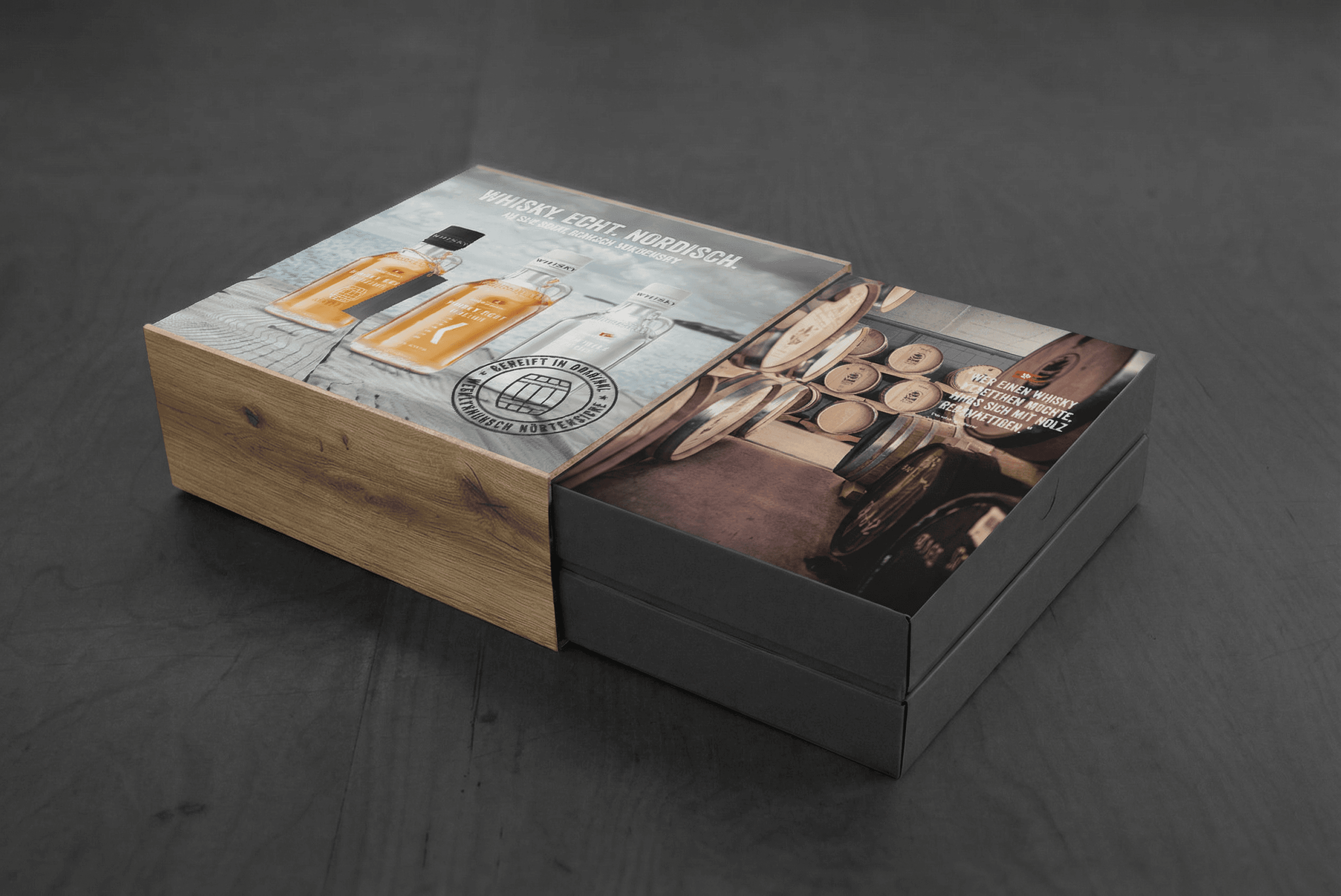 Whisky gift box with bottles and barrels image.