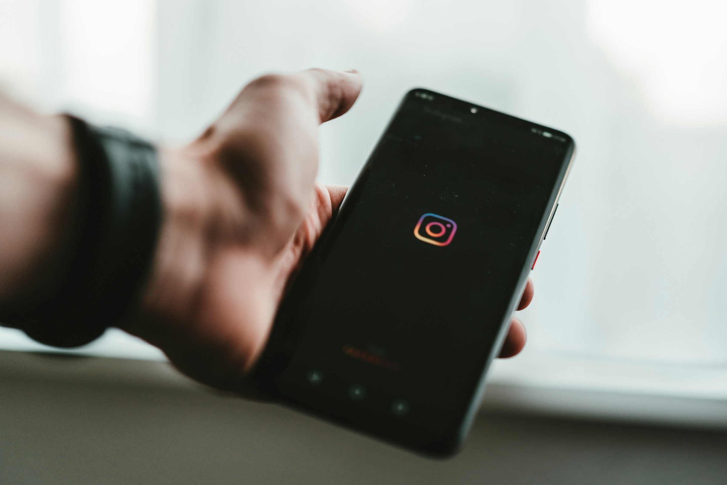 person with mobile app - How To Go Viral on Instagram Reels