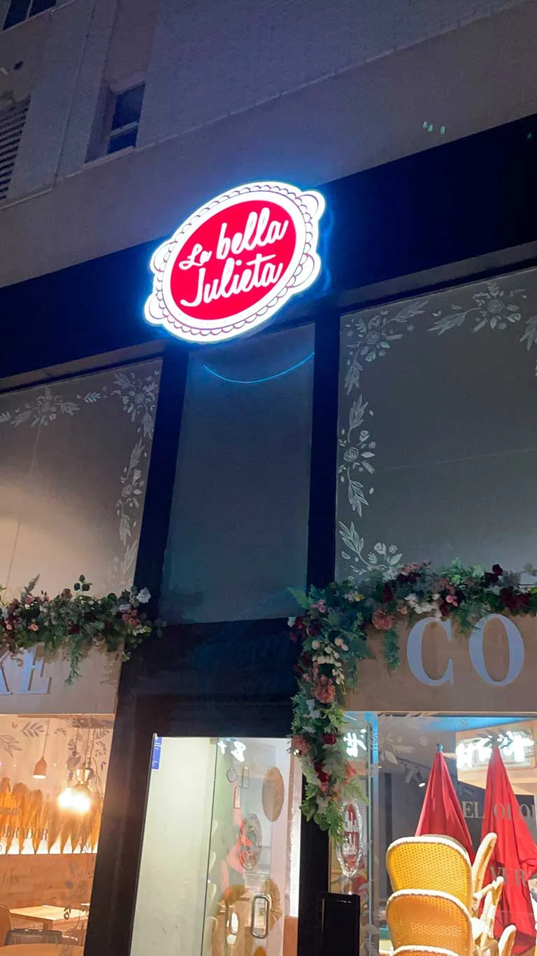 A vintage race car with blue, orange, and white livery