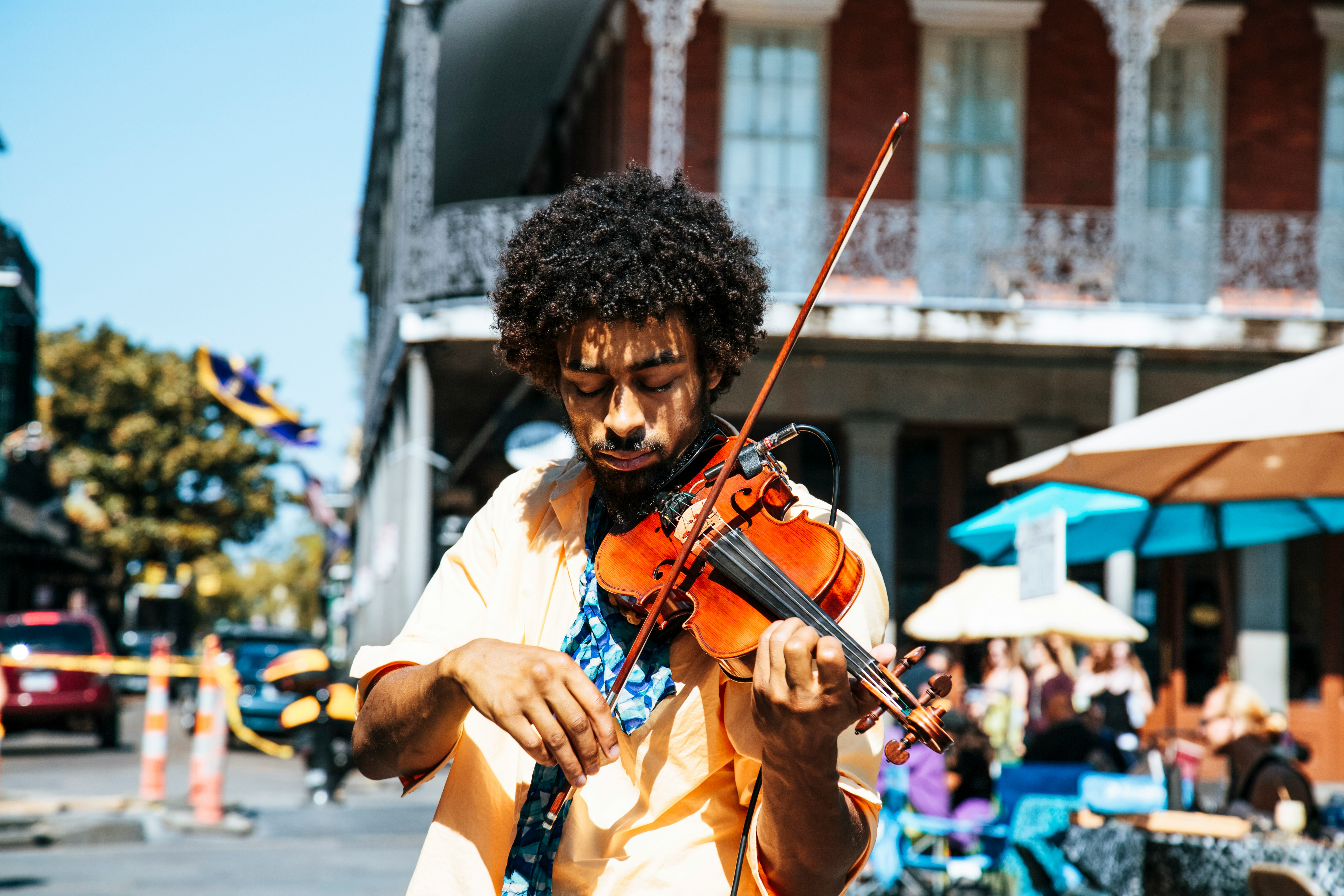 guy playing violin in public