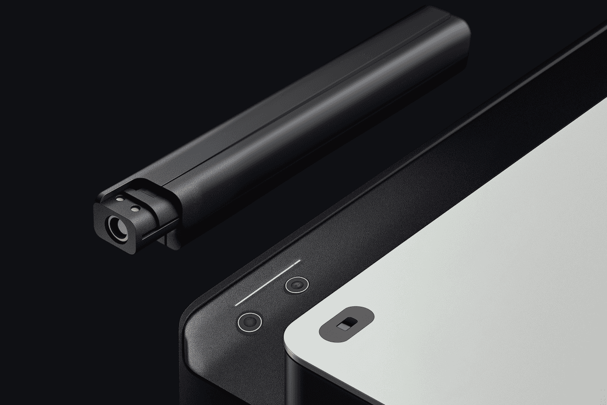 Close-up of a modern electronic device with a transparent casing and gradient blue lighting, showcasing sleek design and internal components.