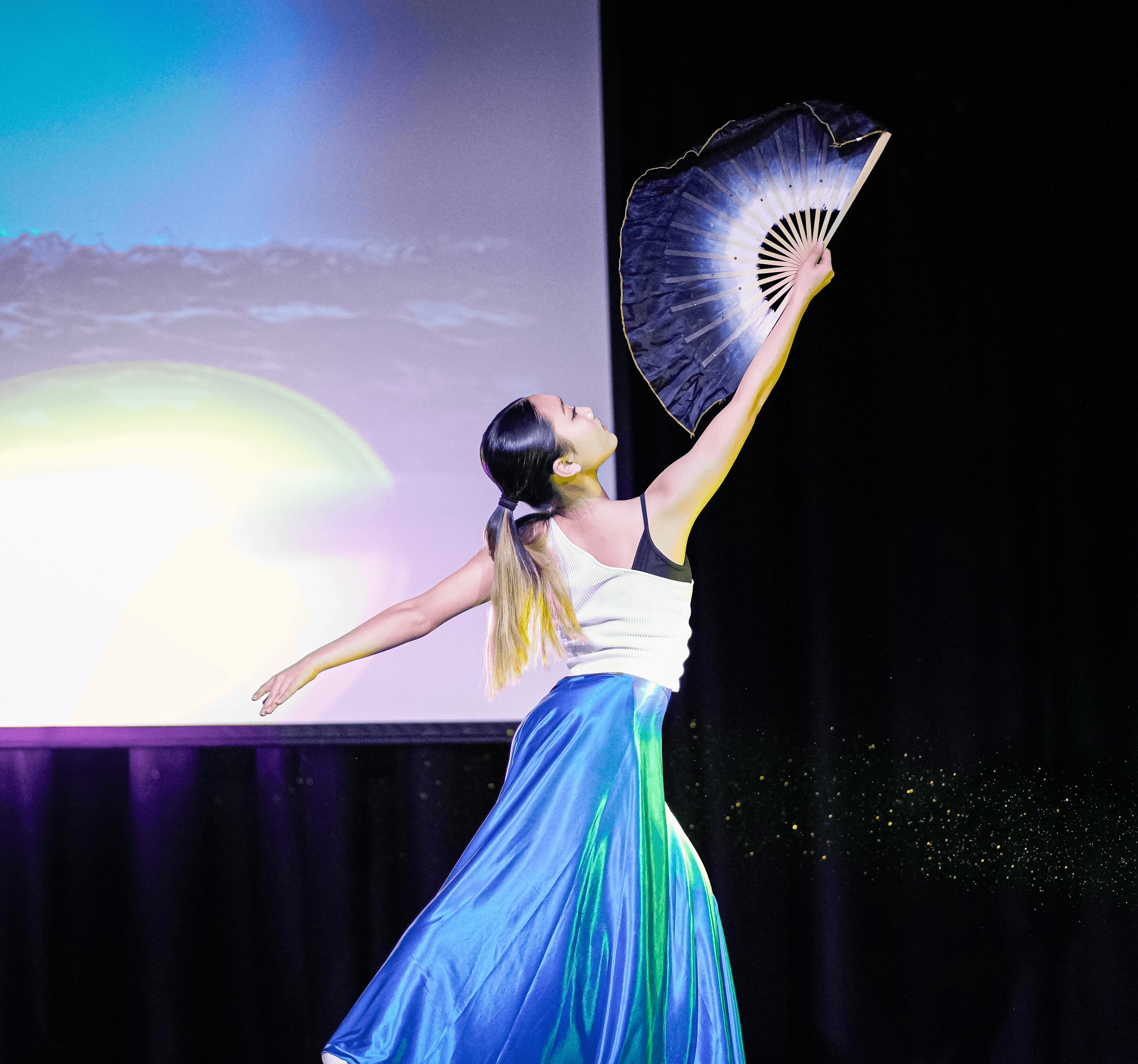 Person surrounded by glowing phones.